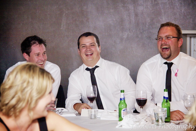 Groomsmen laughing at wedding speeches - wedding photography sydney